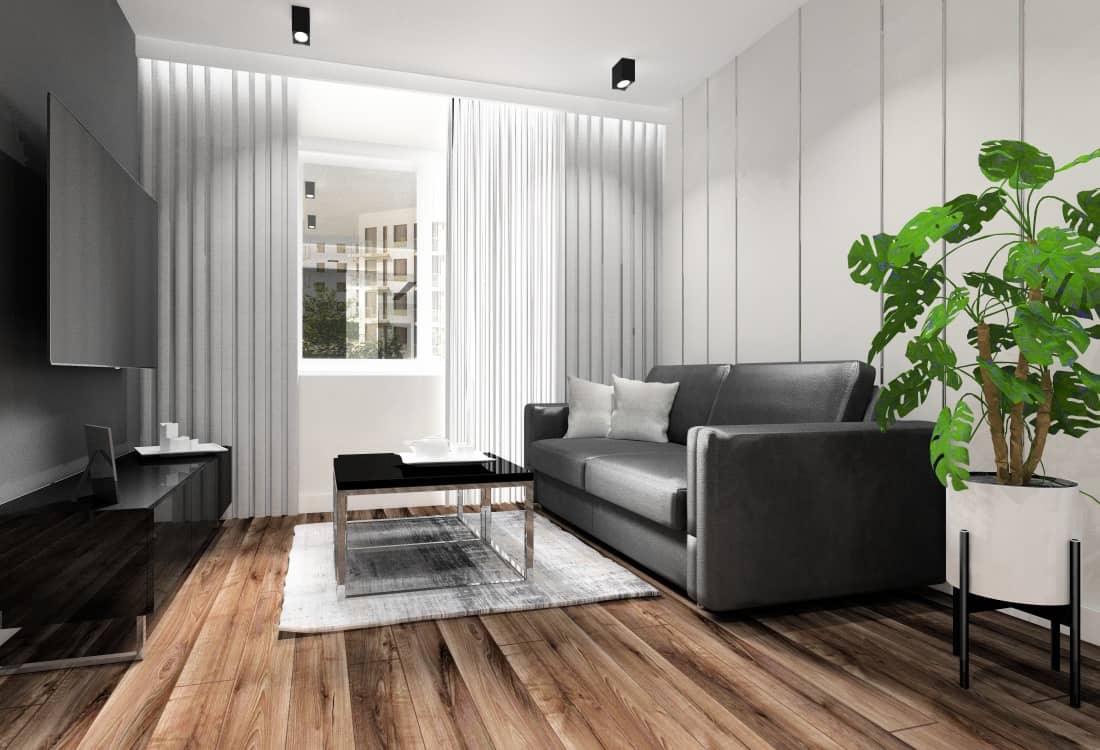 Ściana za sofą w salonie z kuchnią, listwy aluminiowe
